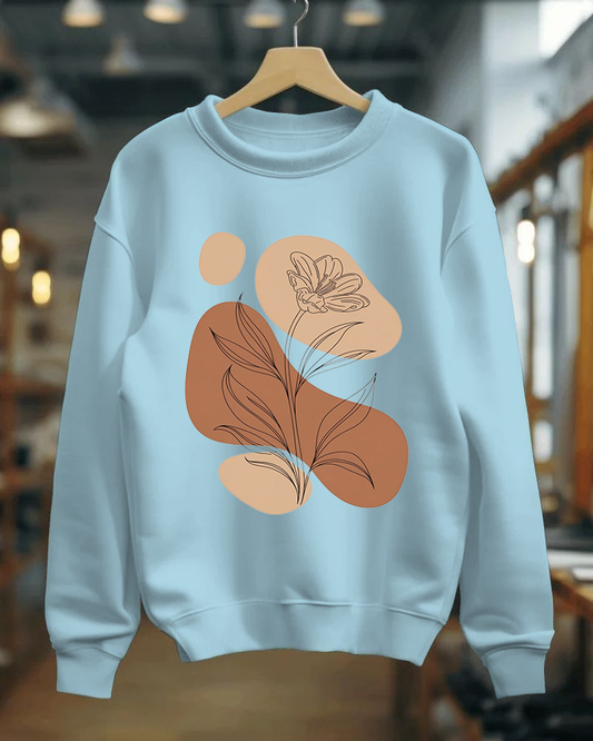 Light blue sweatshirt with abstract brown and beige designs on a hanger.