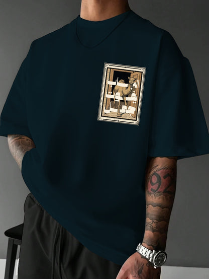 Person wearing a dark blue t-shirt with a graphic design on a gray background