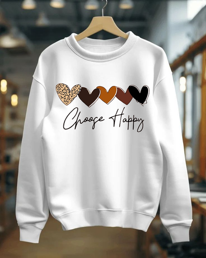 White sweatshirt with colorful heart designs and 'Choose Happy' text on a hanger.