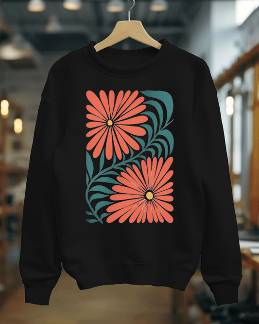 Black sweatshirt with red floral design on a hanger against a blurred indoor background