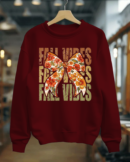 Red sweatshirt with floral butterfly design and text on a hanger.