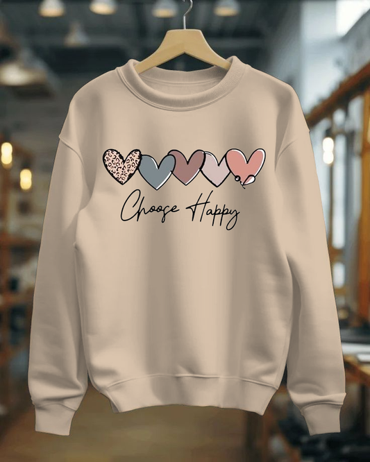 Beige sweatshirt with colorful heart designs and 'Choose Happy' text on a hanger.
