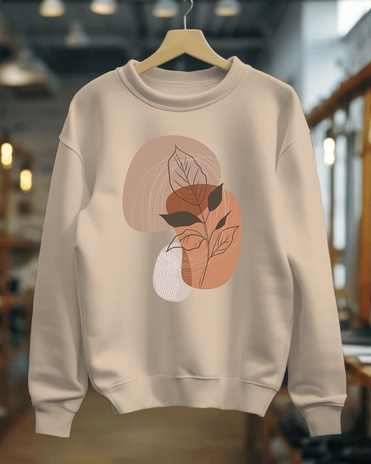 Beige sweatshirt with leaf design on a hanger in a store setting