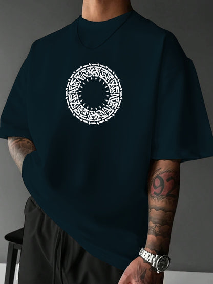 Person wearing a black t-shirt with a white circular design on a gray background