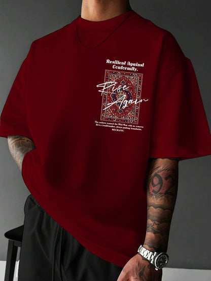 Red t-shirt with graphic design and text worn by a person against a gray background