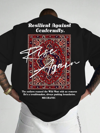 Person wearing a black t-shirt with a graphic and text on the back, standing against a white background.