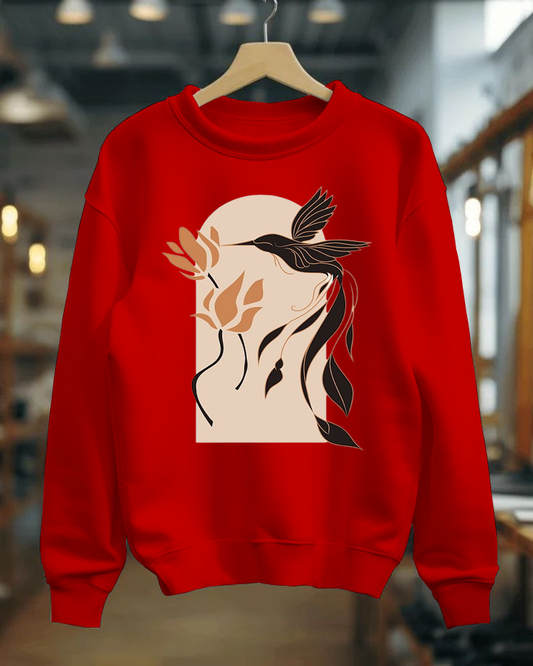 Red sweatshirt with a graphic design of a bird and flowers on a hanger.